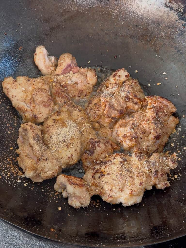Chicken cooking slowly to bloom seasoning aroma
