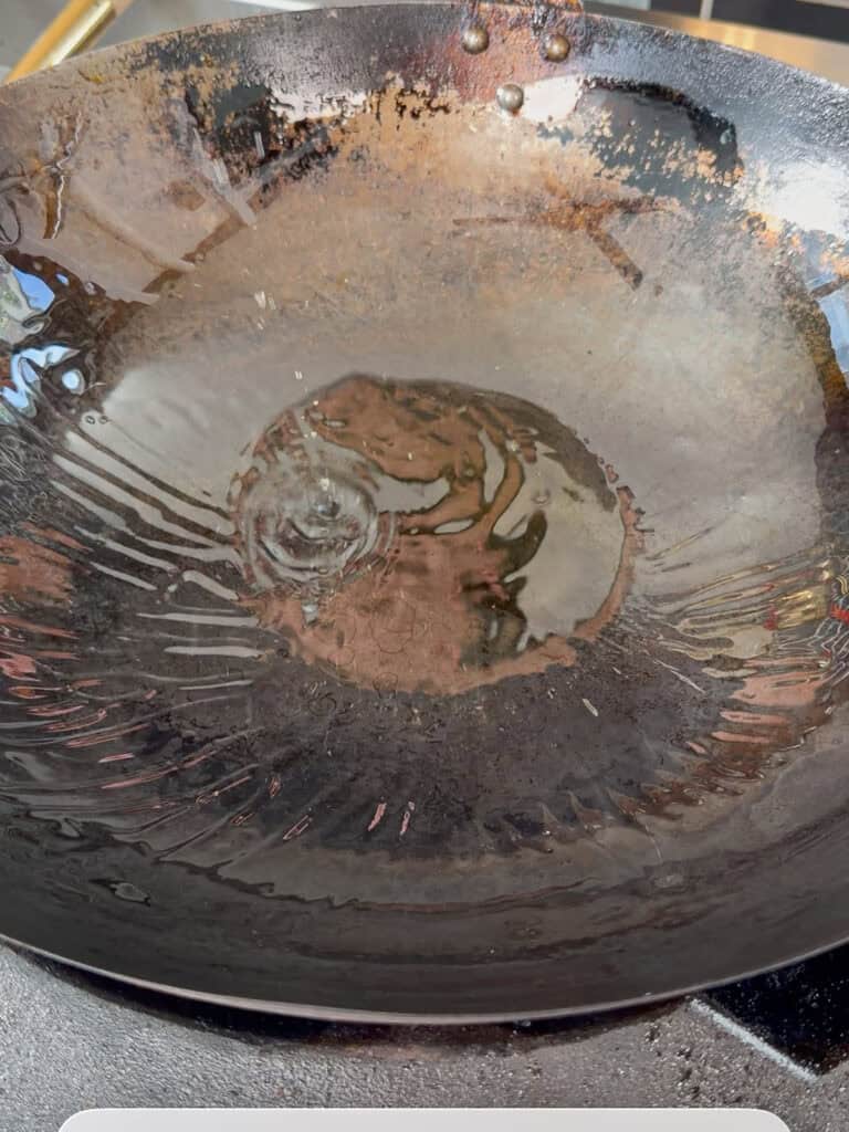 Wok heating with oil on low heat