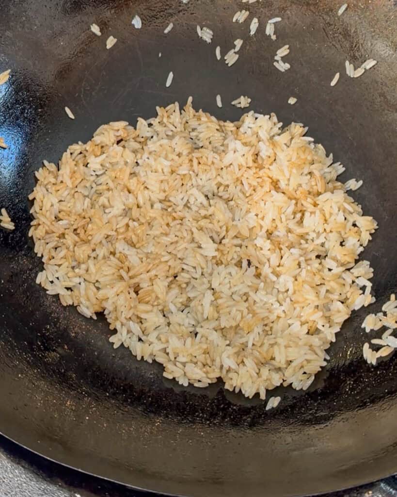 Crispy rice cooking in a wok