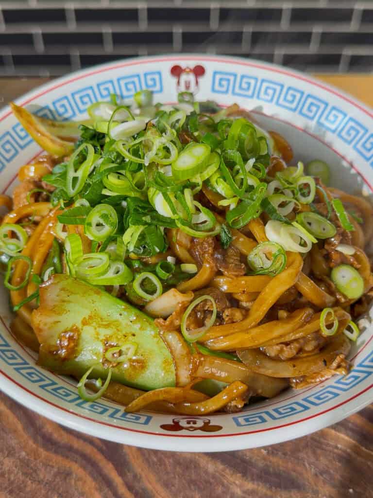 Greens tossed through noodles until just tender
