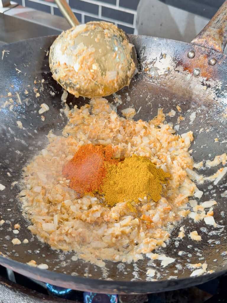 Prepared satay sauce visible in wok.
