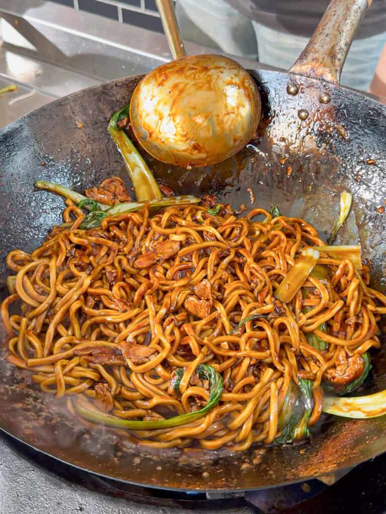 Shanghai pork noodles tossed until glossy and evenly coated in sauce