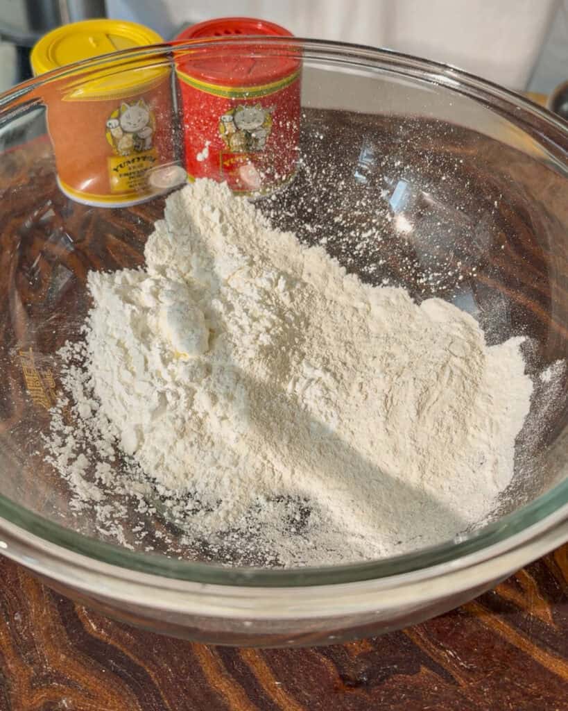 Shows white powder inside a mixing bowl before liquid is incorporated