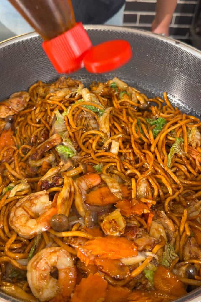 Shrimp mixed with sauced noodles and vegetable