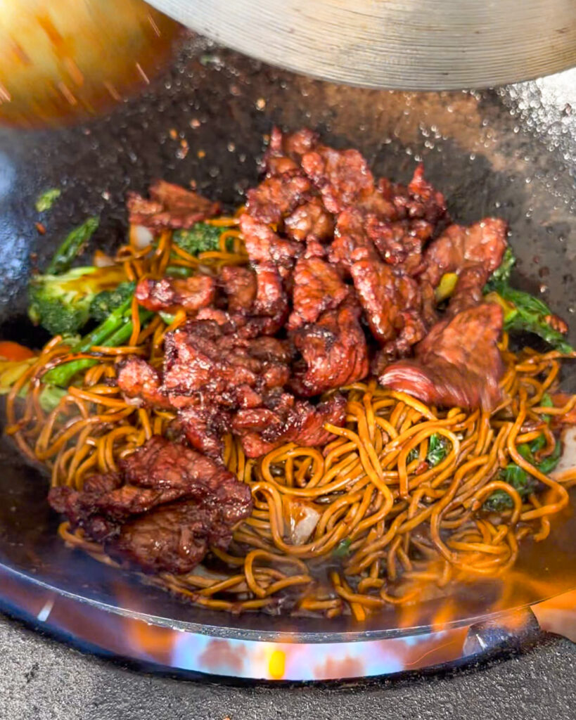 Beef returned to sauce-coated noodles and vegetables for Beef & Black Bean Noodles.